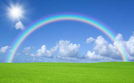 Green field and rainbowの写真素材