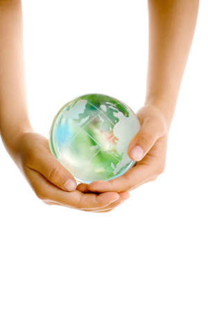 Child holding a globe in handsの写真素材