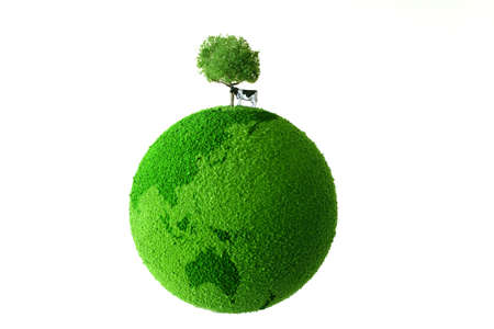 Calf standing on green earthの写真素材
