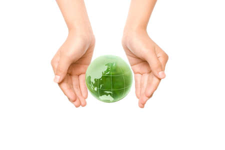 Child holding a globe in hands.の写真素材