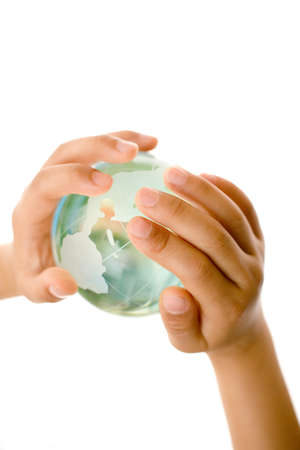 Child holding a globe in hands.の写真素材