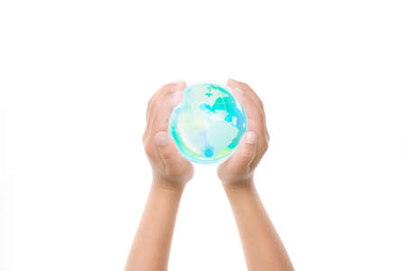 Child holding a globe in handsの写真素材