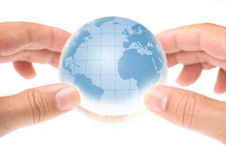 Child holding a globe in handsの写真素材