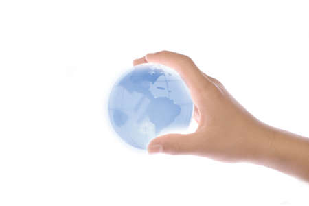 Child holding a globe in handの写真素材