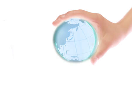 Child holding a globe in handの写真素材