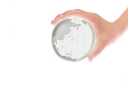 Child holding a globe in handの写真素材