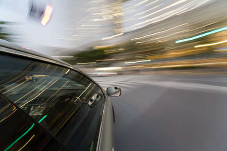 The car moves at great speed at the eveningの写真素材