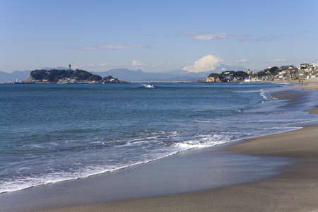 Beach and waves, Mt Fuji and Enoshima Island.の写真素材