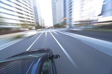 The car moves at great speed at the eveningの写真素材