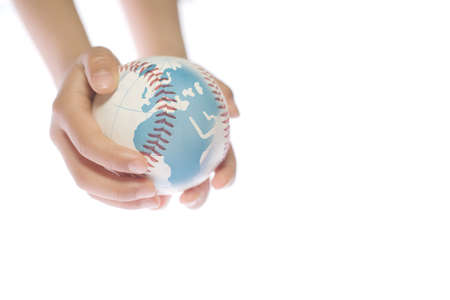 This is a photo of a globe print baseball on white background.の写真素材