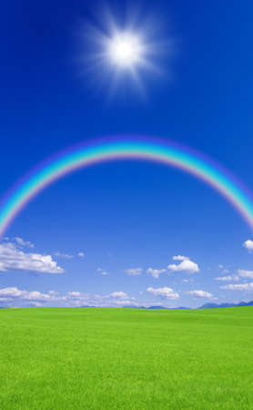 Green grass and rainbowの写真素材