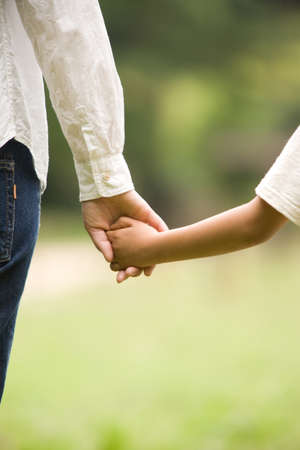 Hands of mother and sonの写真素材