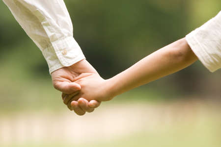 Hands of mother and sonの写真素材