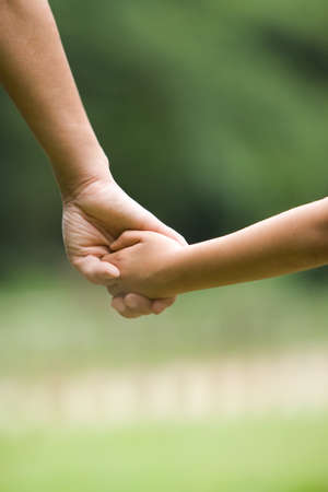 Hands of mother and sonの写真素材
