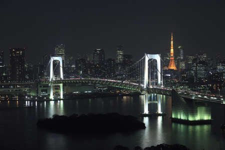 View of Tokyo downtown at night with Rainbow Bridge の写真素材