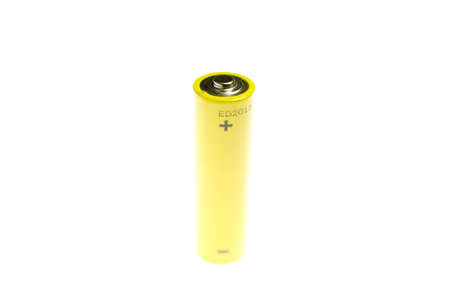Gold battery in upright position with focus to the positive terminal at the topの写真素材
