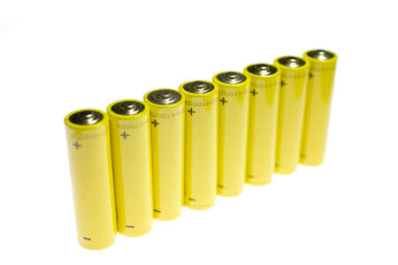 Gold battery in upright position with focus to the positive terminal at the topの写真素材