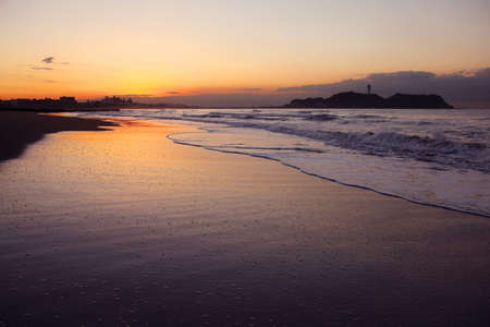 Cloud and shore and Enoshima of the morning glowの写真素材