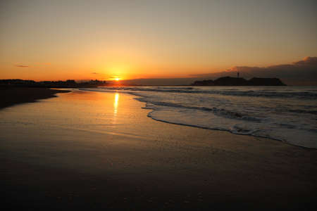 Cloud and shore and Enoshima of the morning glowの写真素材