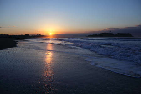 Cloud and shore and Enoshima of the morning glowの写真素材