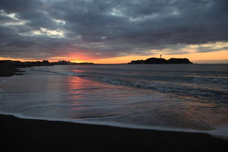 Cloud and shore and Enoshima of the morning glowの写真素材