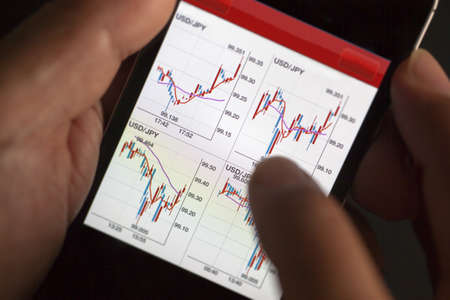 Foreign exchange market chart at smart phoneの写真素材