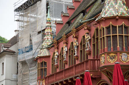 Redoutenhaus Freiburg on an overcast day with the building behind it under construction