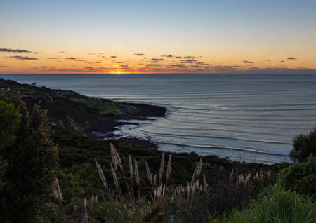 Manu Bay Sunset in Raglan, New Zealandの写真素材