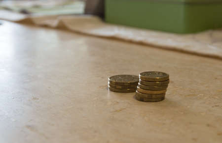Stack of Australian one and two dollars coins