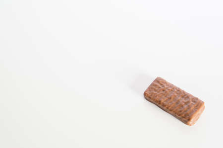 Iconic Australian chocolate biscuit on a white bench