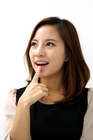 Beautiful young woman thinkingの写真素材