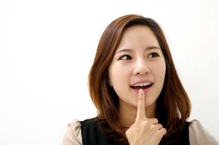 Beautiful young woman thinkingの写真素材