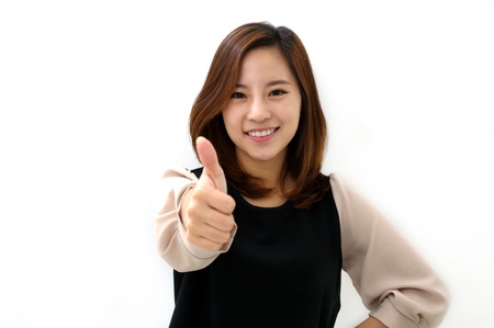 Success woman thumbs upの写真素材
