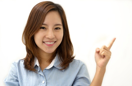 Close-up of a young woman pointingの写真素材