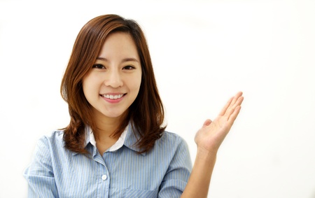 Showing businesswoman, isolated on whiteの写真素材