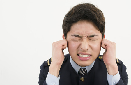 Stressed Asian Airline Pilotの写真素材