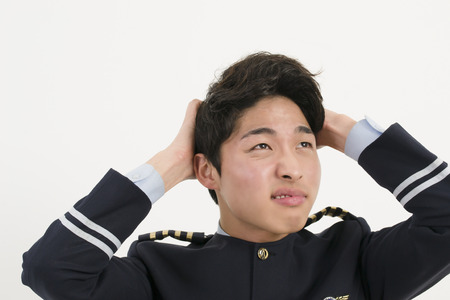 Stressed Asian Airline Pilotの写真素材
