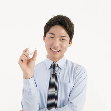 Asian business man with soju glassの写真素材