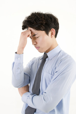 Stressed asian businessmanの写真素材