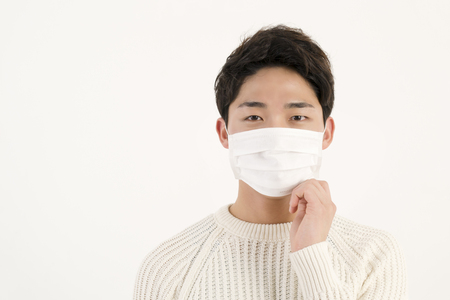 Asian man wearing a face maskの写真素材