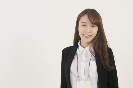 Beautiful young asian businesswoman with id cardの写真素材