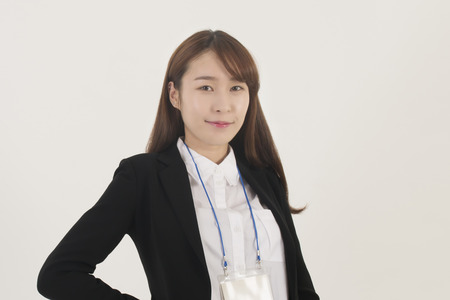 Beautiful young asian businesswoman with id cardの写真素材
