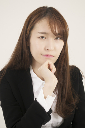 Stressed asian businesswomanの写真素材