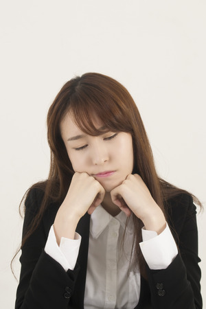 Stressed asian businesswomanの写真素材