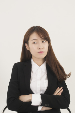 Beautiful young woman thinkingの写真素材