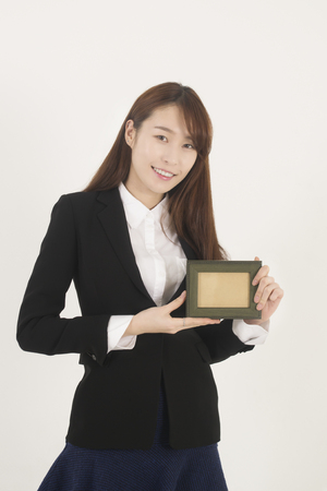 Beautiful asian woman with frameの写真素材