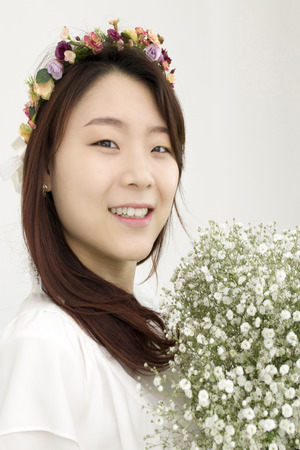 Beautiful asian bride with chapletの写真素材