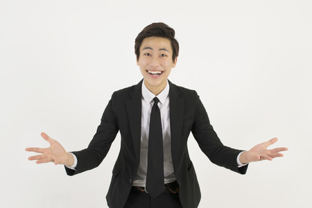 Successful business man spreading armsの写真素材