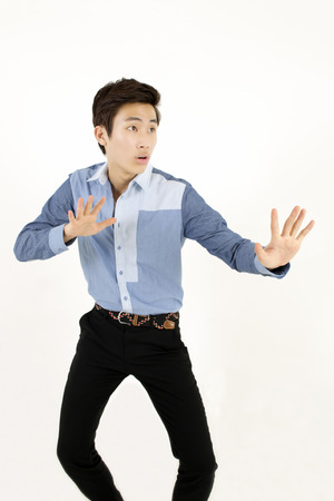 Serious young man showing stop or no gestureの写真素材