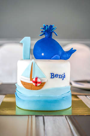 A fancy birthday cake to celebrate a boy's first birthdayの素材